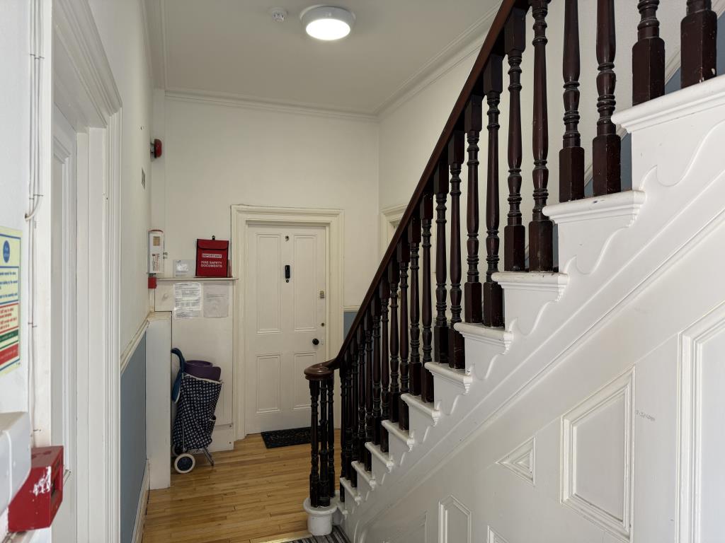 Lot: 1 - SUBSTANTIAL FREEHOLD INVESTMENT COMPRISING ELEVEN FLATS - Ground floor communal hall with stairs